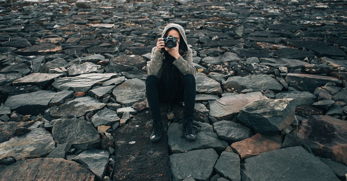 Using cueritos (Pork Rinds) for ground beef - Concentrated photographer taking picture on stones Using cueritos (Pork Rinds) for ground beef - Concentrated photographer taking picture on stones