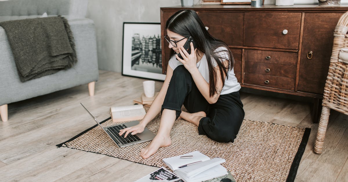Using my own wood for smoking? - Woman Using Her laptop While Having A Conversation Over The Phone