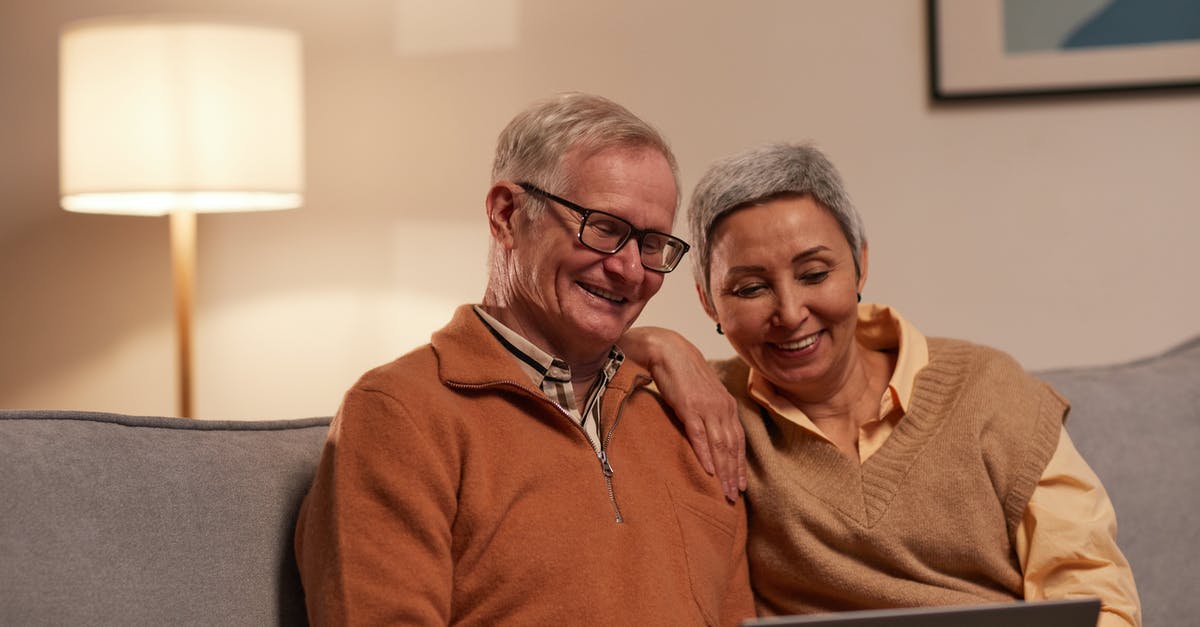 Using older frozen vegetables - Man and Woman Sitting on Sofa While Looking at a Laptop Using older frozen vegetables - Man and Woman Sitting on Sofa While Looking at a Laptop