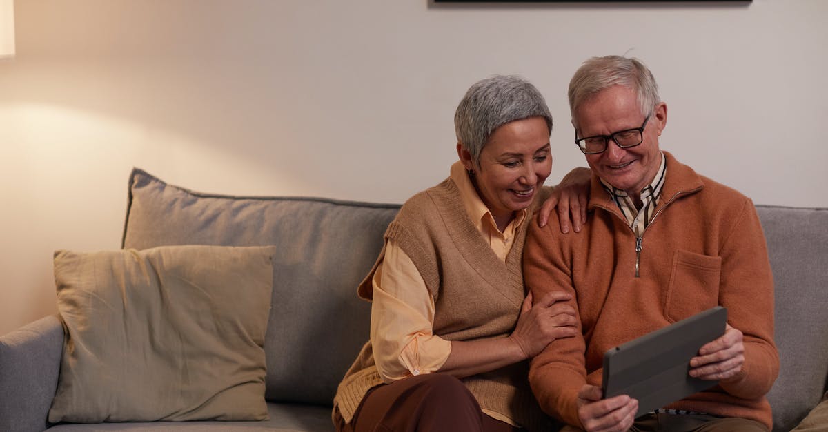 Using older frozen vegetables - Man and Woman Sitting on Sofa While Looking at a Tablet Computer Using older frozen vegetables - Man and Woman Sitting on Sofa While Looking at a Tablet Computer