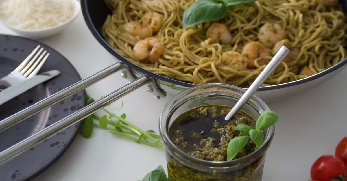 Using pesto as a sauce ingredient - Pesto Noodles in Close-Up Photography Using pesto as a sauce ingredient - Pesto Noodles in Close-Up Photography