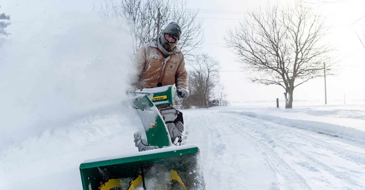 Using powdered salt vs regular - Man with Snow Blower on the Road Using powdered salt vs regular - Man with Snow Blower on the Road