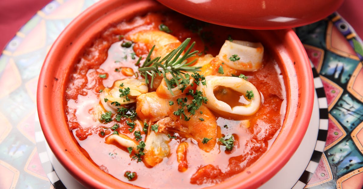 Using sauce as a soup base - Squid Soup on Red Ceramic Bowl Using sauce as a soup base - Squid Soup on Red Ceramic Bowl