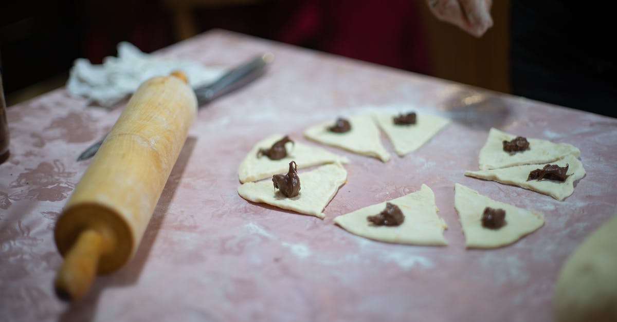Using sugar when making pizza dough - Brown Wooden Rolling Pin on White Textile Using sugar when making pizza dough - Brown Wooden Rolling Pin on White Textile