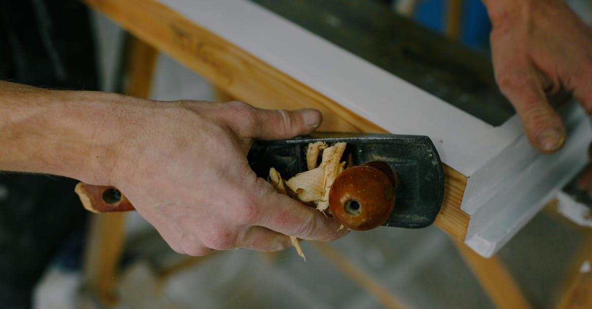 Using the bone from a spiral cut ham - Crop carpenter working with window frame using plane Using the bone from a spiral cut ham - Crop carpenter working with window frame using plane
