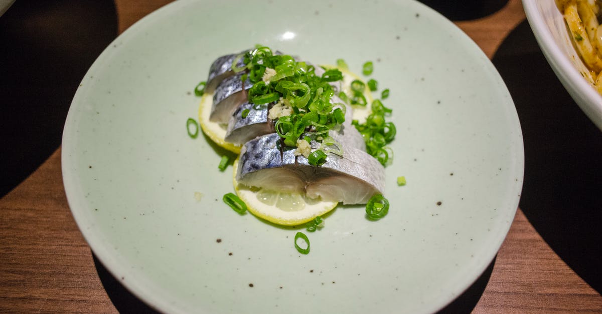 UV lamp to disinfect raw sushi fish slices - Slices of Fish in a Plate UV lamp to disinfect raw sushi fish slices - Slices of Fish in a Plate