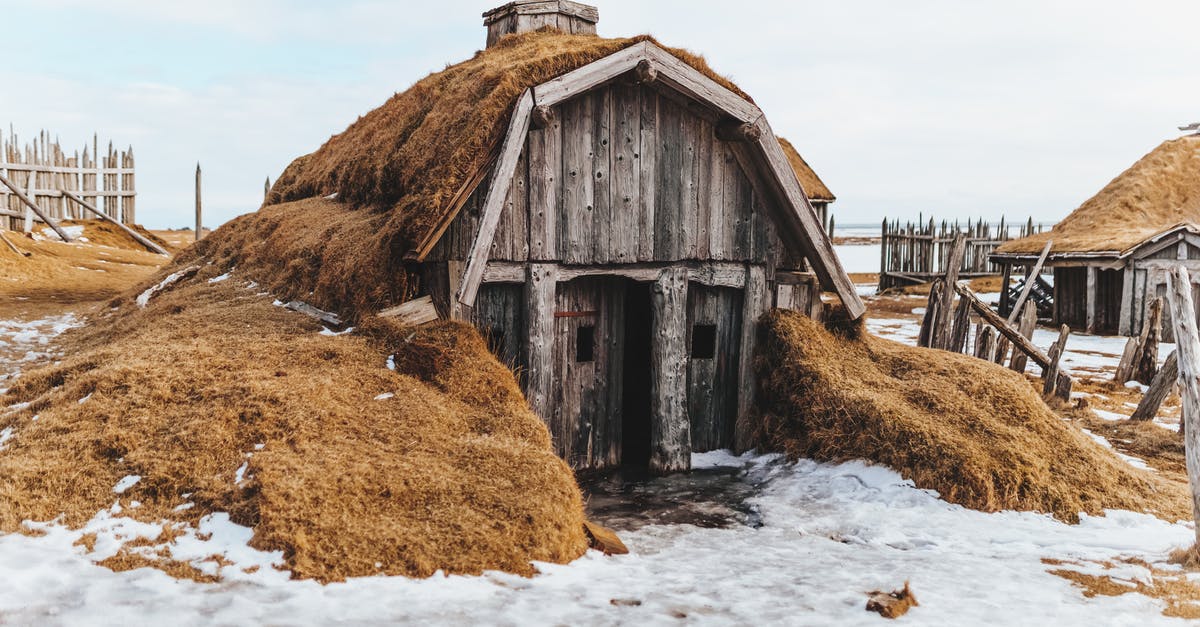 Vacuum sealed frozen salmon burgers - seal broken due to thawing? - Shabby wooden house with grass covered roof in snowy terrain with forgotten village