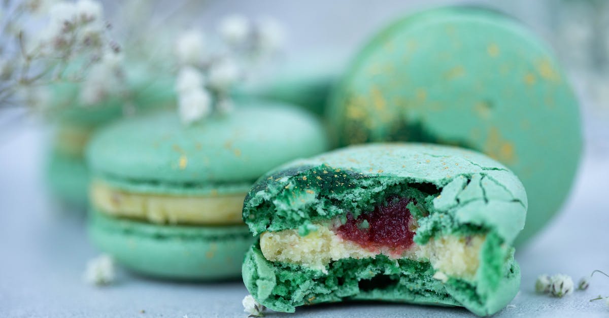 Vacuum sealing jars of Simple Syrup - Sweet green macaroons with syrup and cream Vacuum sealing jars of Simple Syrup - Sweet green macaroons with syrup and cream
