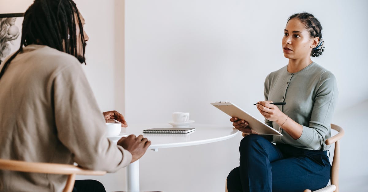 Vacuum-packed cheese question (botulism) - Ethnic female psychotherapist listening to black clients explanation Vacuum-packed cheese question (botulism) - Ethnic female psychotherapist listening to black clients explanation