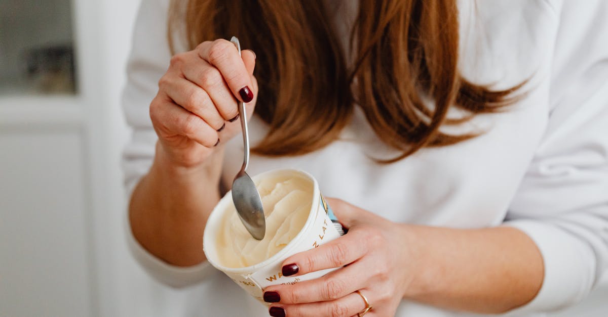 Vanilla extract cups vs spoon - Close-Up Photo of a Woman's Hands Getting Ice Cream in a Cup Vanilla extract cups vs spoon - Close-Up Photo of a Woman's Hands Getting Ice Cream in a Cup