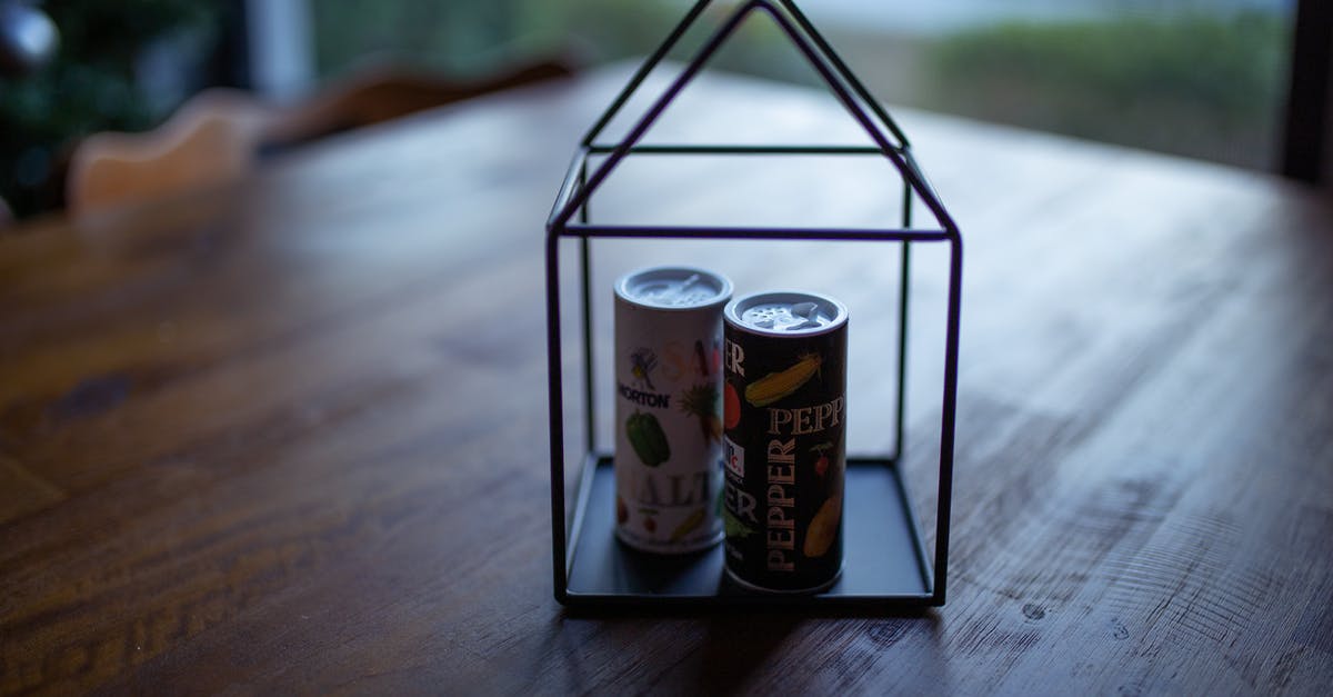 Vermouth for use in Drinks - can I freeze it? - Two Labeled Thin Cans on Black Frame