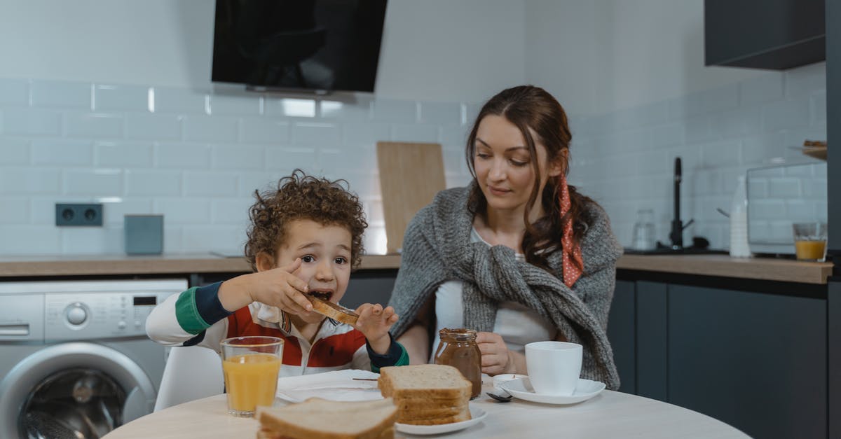Vietnamese Sandwiches - Spread Identification? - A Kid Eating Sandwich with Chocolate Spread with Her Mother Vietnamese Sandwiches - Spread Identification? - A Kid Eating Sandwich with Chocolate Spread with Her Mother