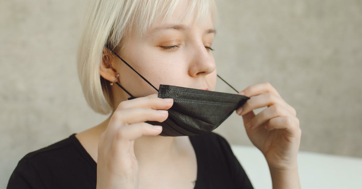 vinegar pickles safety - A Woman Wearing Face Mask and Gloves while Using Her Mobile Phone