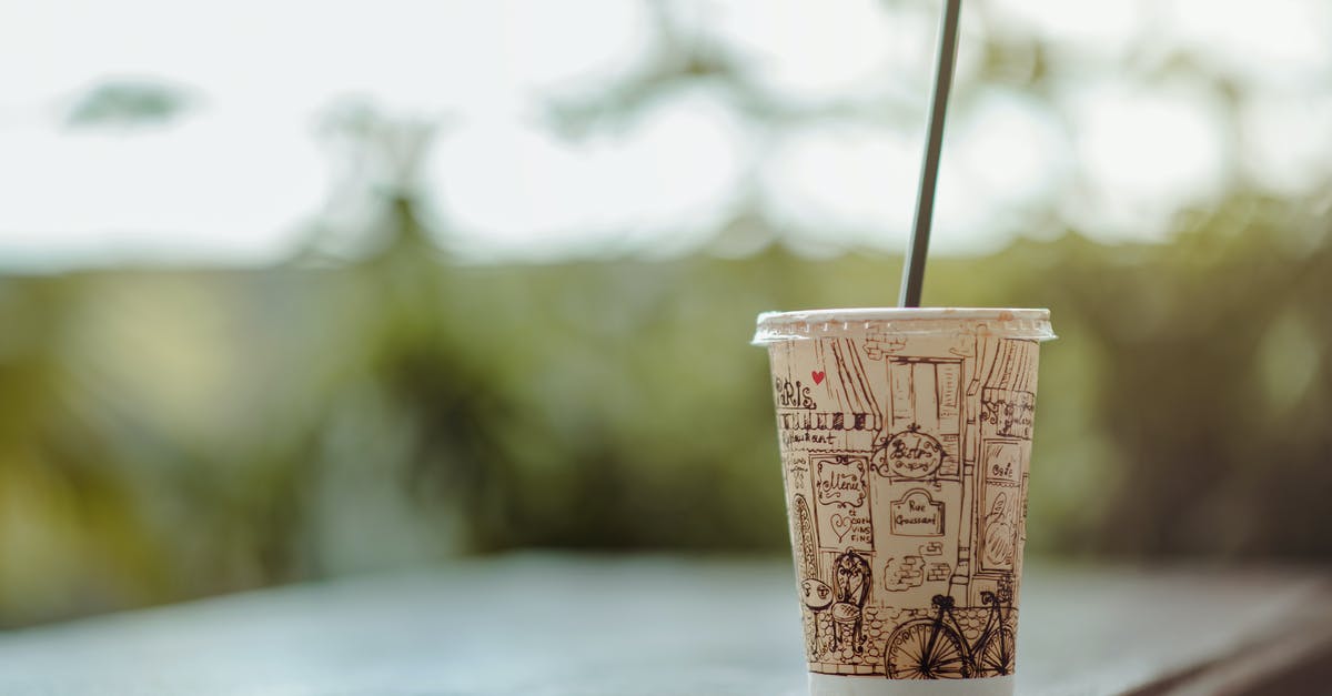 Vintage Pyrex Measuring Cup Borosilicate Vs. Soda Lime Color Difference? - Selective Focus Photo of White Plastic Cup With Lid and Straw