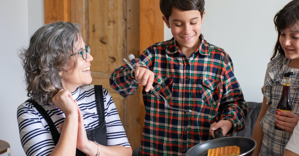 waffle cones for serving lattes - A Young Boy in Plaid Long Sleeves Holding a Cooking Pan with Waffle waffle cones for serving lattes - A Young Boy in Plaid Long Sleeves Holding a Cooking Pan with Waffle