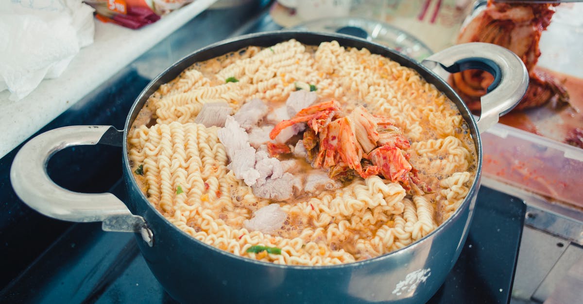 Water boiling and cooking time - Close-Up Photo of a Pot with Noodles and Kimchi Water boiling and cooking time - Close-Up Photo of a Pot with Noodles and Kimchi