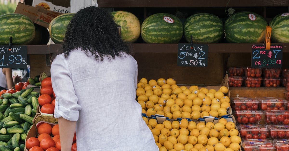 Watermelon - picking and managing them during heat - Woman in White Polo Standing on Fruit Store Watermelon - picking and managing them during heat - Woman in White Polo Standing on Fruit Store