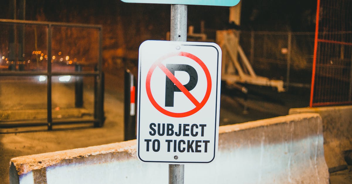 Way to Prevent Rusting Racks? - Prohibition parking road sign with Subject To Ticket inscription placed on street of city near concrete barrier in evening time Way to Prevent Rusting Racks? - Prohibition parking road sign with Subject To Ticket inscription placed on street of city near concrete barrier in evening time