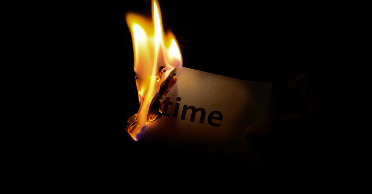 Wet-heat cooking intensity vs. time - Person Holding Burning Paper in Dark Room Wet-heat cooking intensity vs. time - Person Holding Burning Paper in Dark Room