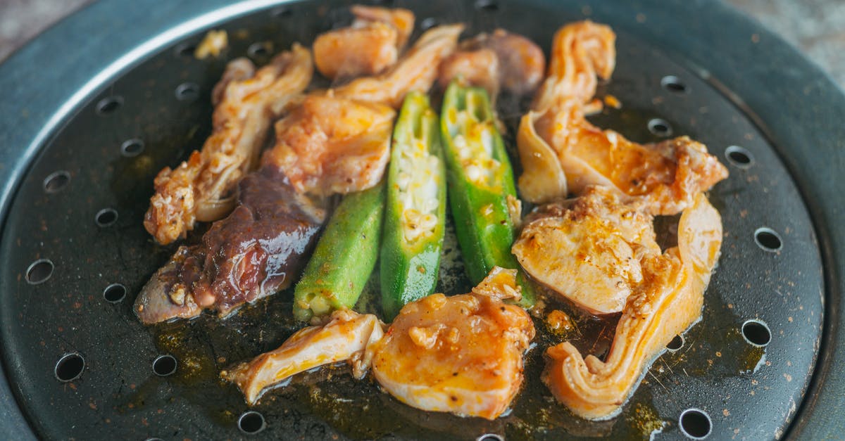 What's a pan and what's a pot? - Cooked Food on Round Iron Barbecue Grill Plate What's a pan and what's a pot? - Cooked Food on Round Iron Barbecue Grill Plate
