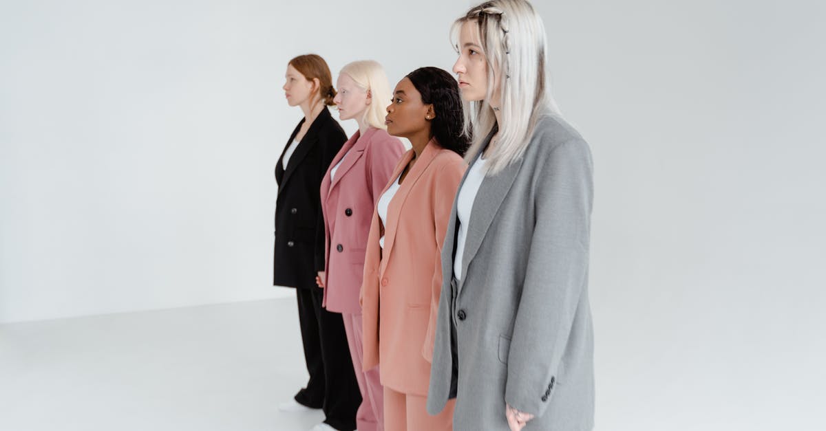 What's are the benefits of different sourdough starter consistencies? - Woman in Gray Blazer Standing Beside Woman in Pink Blazer What's are the benefits of different sourdough starter consistencies? - Woman in Gray Blazer Standing Beside Woman in Pink Blazer