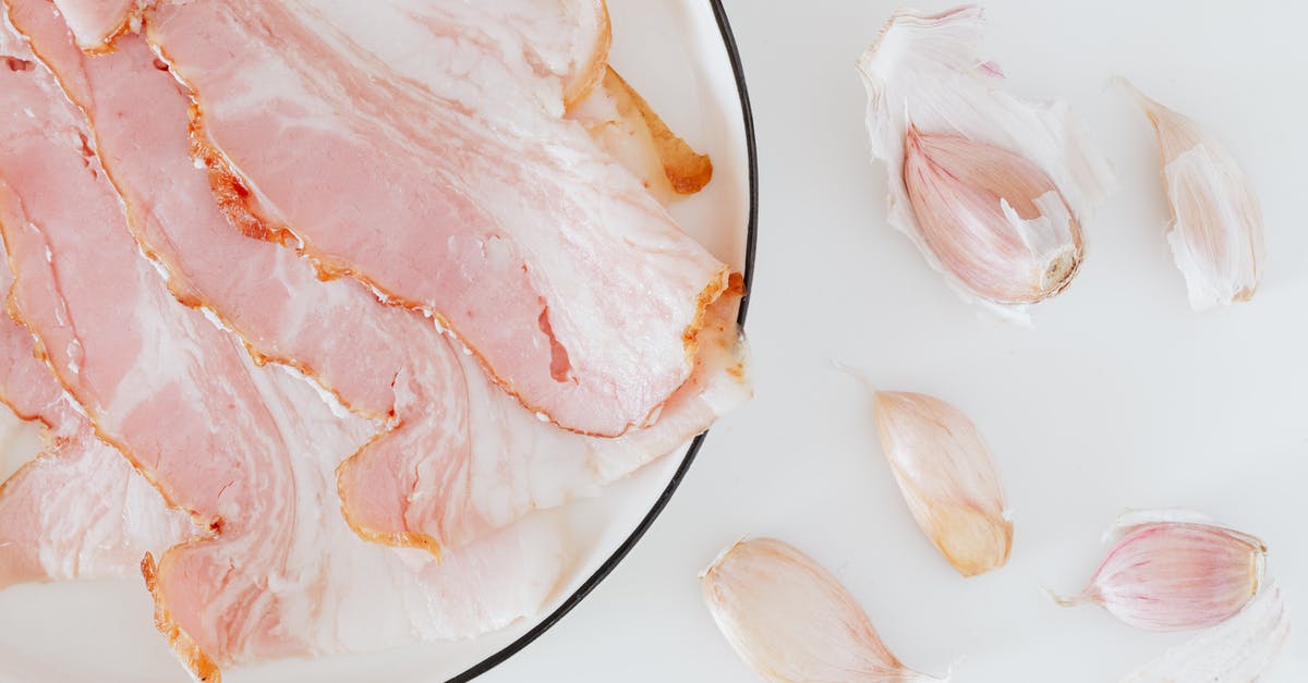 What's the best method for preparing a smoked cod roe breakfast? - Composition of bacon and garlic on desk What's the best method for preparing a smoked cod roe breakfast? - Composition of bacon and garlic on desk