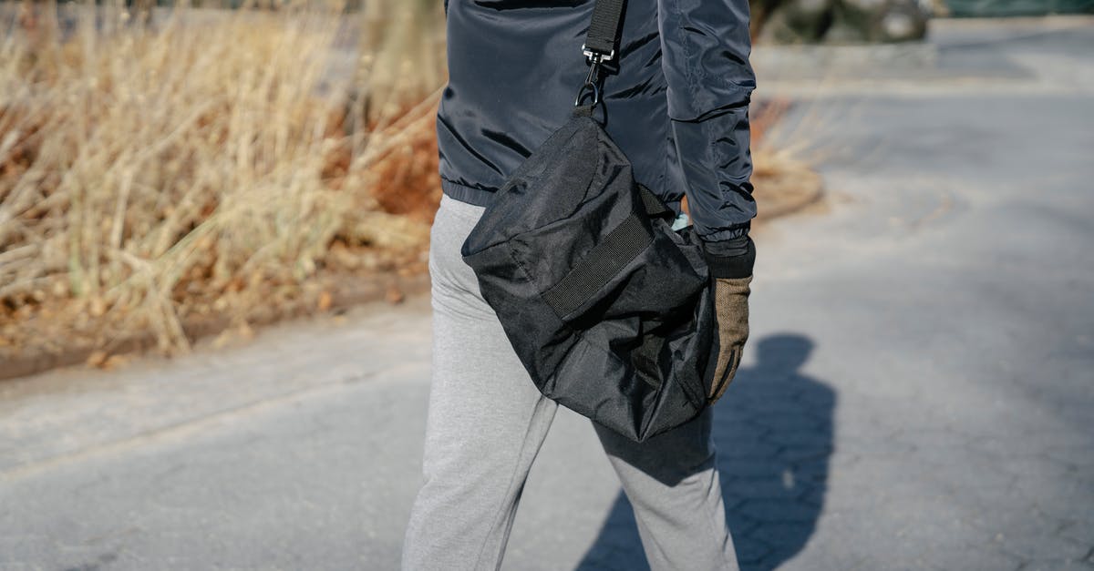What's the best way to cook fall-off-the-bone baby-back ribs - Crop person in outerwear walking with bag in autumn What's the best way to cook fall-off-the-bone baby-back ribs - Crop person in outerwear walking with bag in autumn
