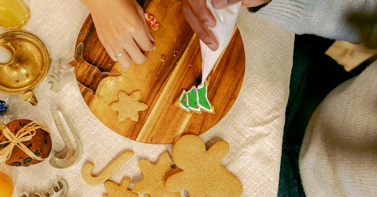 What's the best way to stick sprinkles to cookies without icing? - Person Decorating a Cookie with Icing What's the best way to stick sprinkles to cookies without icing? - Person Decorating a Cookie with Icing