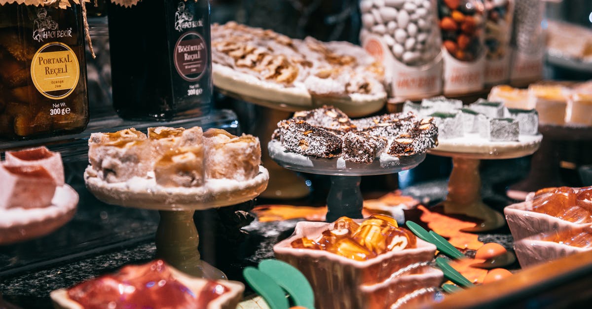 What's the difference between jam, jelly, and preserves? - Assorted Turkish delights and jam on showcase of market selling delicious traditional sweets What's the difference between jam, jelly, and preserves? - Assorted Turkish delights and jam on showcase of market selling delicious traditional sweets