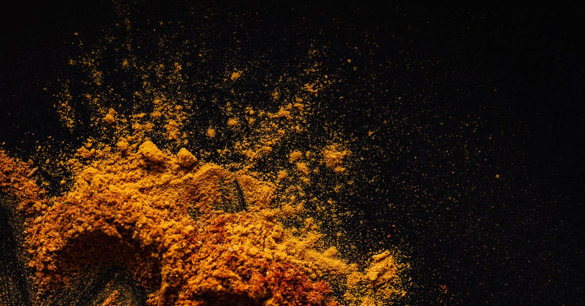 What's the Effect of Browning Butter - Composition of multicolored ground spices spilled on black background What's the Effect of Browning Butter - Composition of multicolored ground spices spilled on black background