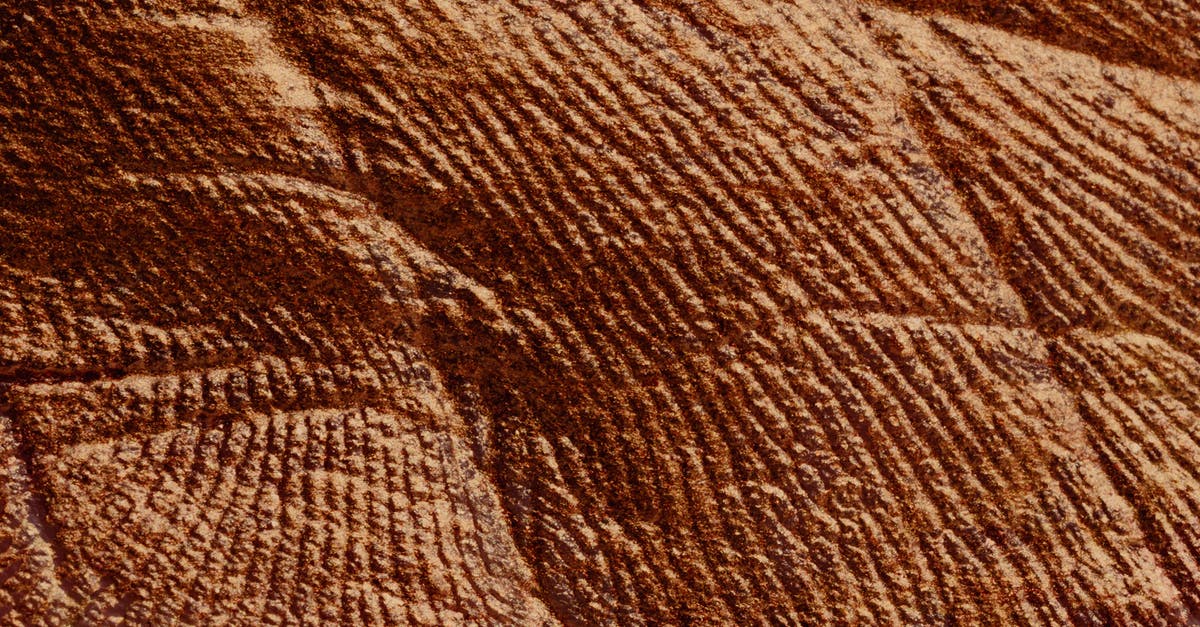 What's the Effect of Browning Butter - Closeup of abstract rough textured parget surface of brown color with cracks What's the Effect of Browning Butter - Closeup of abstract rough textured parget surface of brown color with cracks