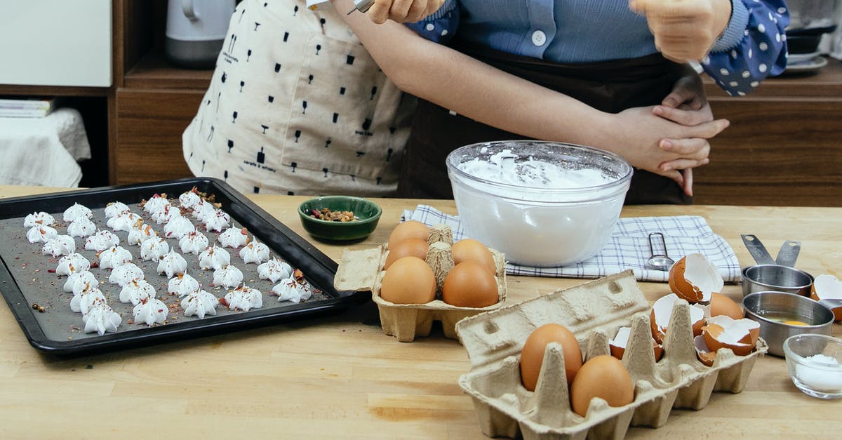 What's the minimum time to cook raw prawns? - Crop anonymous adolescent embracing cook while preparing meringue cookies with condiments at table in house kitchen What's the minimum time to cook raw prawns? - Crop anonymous adolescent embracing cook while preparing meringue cookies with condiments at table in house kitchen