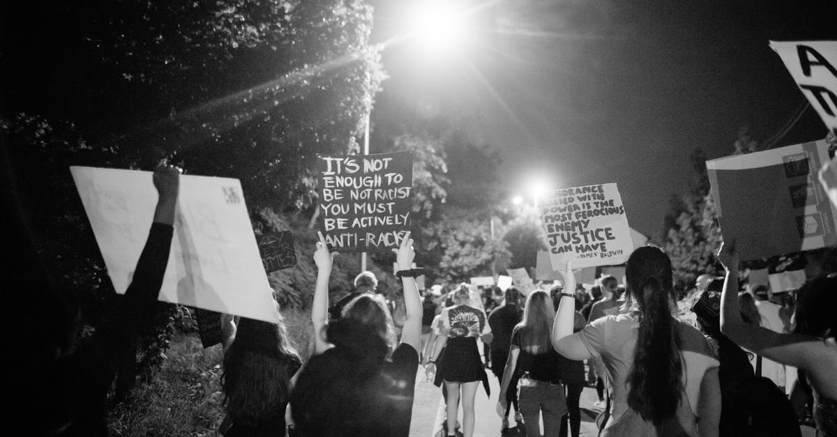 What's the right way to add extra gluten to dough? - Back view of black and white crowd of unrecognizable protesting people walking on street with banners during anti racism demonstration What's the right way to add extra gluten to dough? - Back view of black and white crowd of unrecognizable protesting people walking on street with banners during anti racism demonstration
