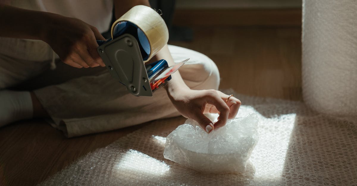 What's the trick to wrapping tightly in plastic wrap? - Person Holding White and Black Vr Goggles What's the trick to wrapping tightly in plastic wrap? - Person Holding White and Black Vr Goggles