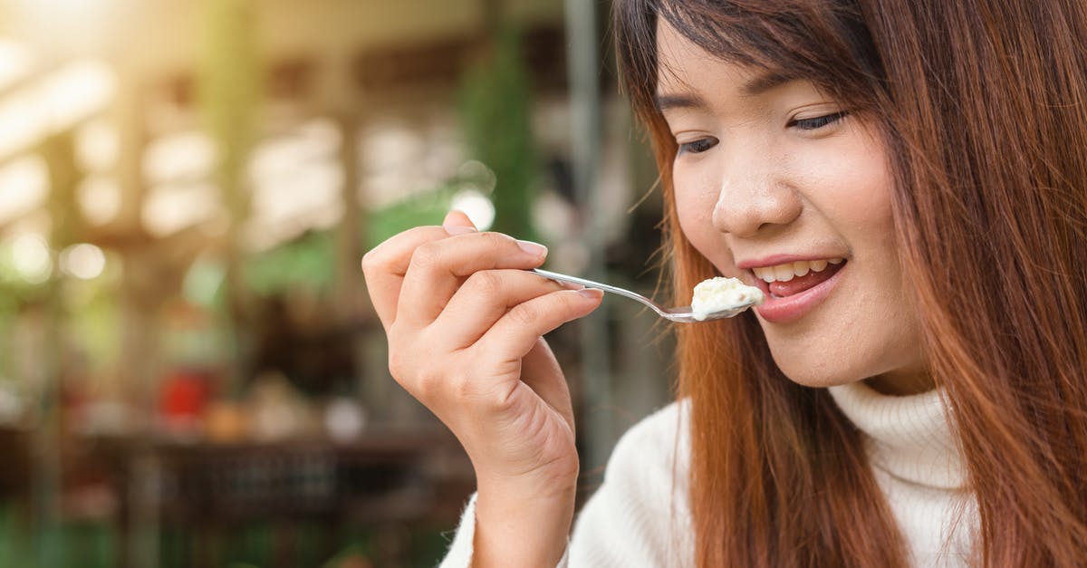 What's the US equivalent of double and single cream? - Woman Holding Spoon Trying to Eat White Food What's the US equivalent of double and single cream? - Woman Holding Spoon Trying to Eat White Food