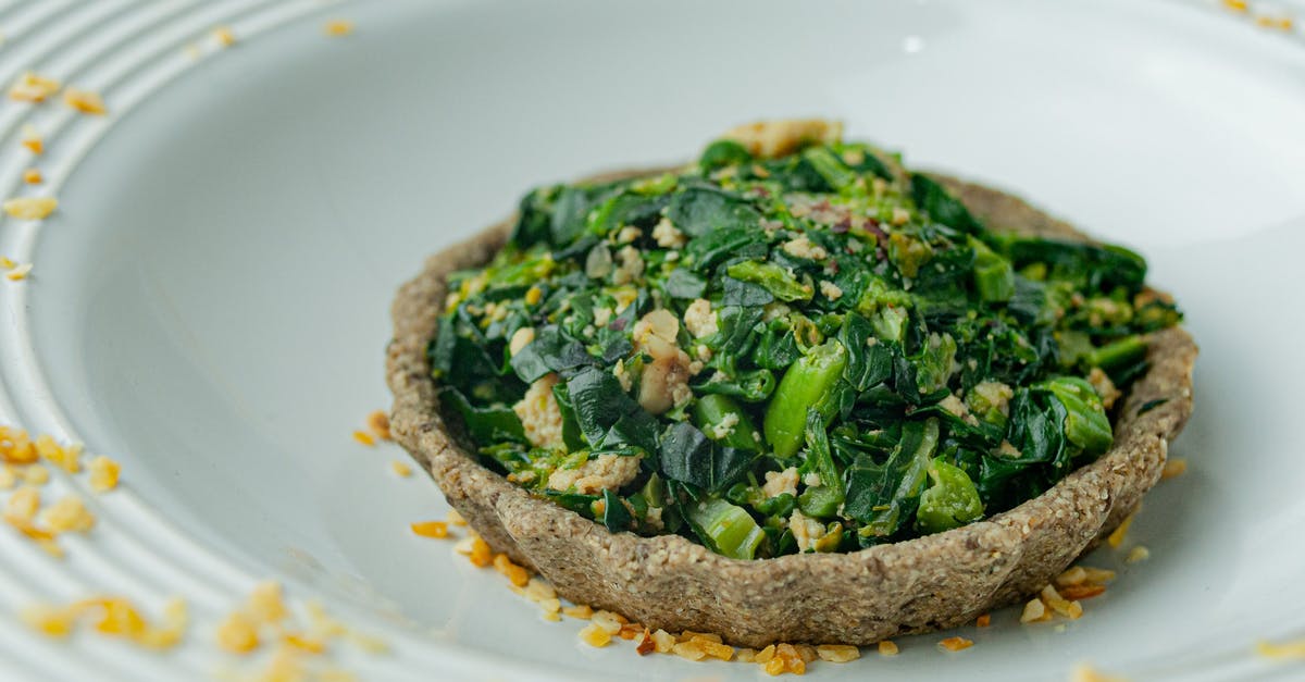 What's this green crispy vegetable or edible seaweed? - Delicious salad in crispy tartlet served on plate What's this green crispy vegetable or edible seaweed? - Delicious salad in crispy tartlet served on plate
