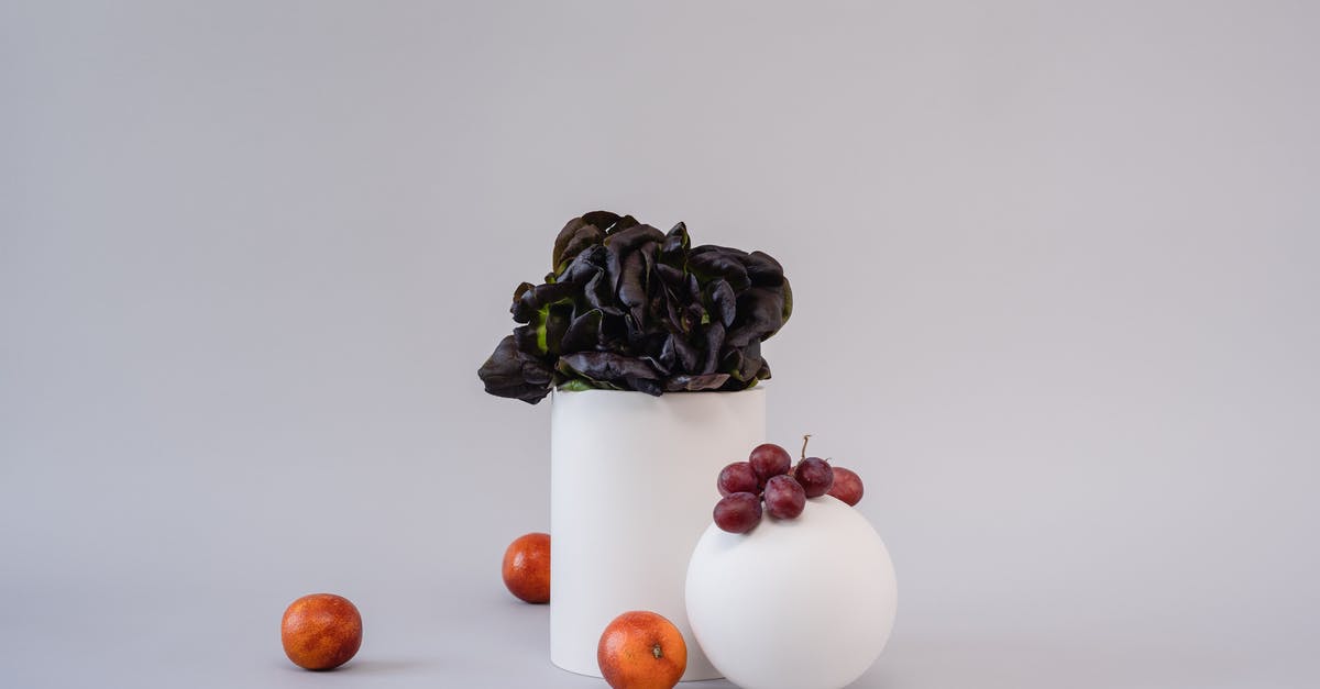 What's this salad of gray lumps in white dressing? - White Ceramic Vase With Orange Fruits What's this salad of gray lumps in white dressing? - White Ceramic Vase With Orange Fruits