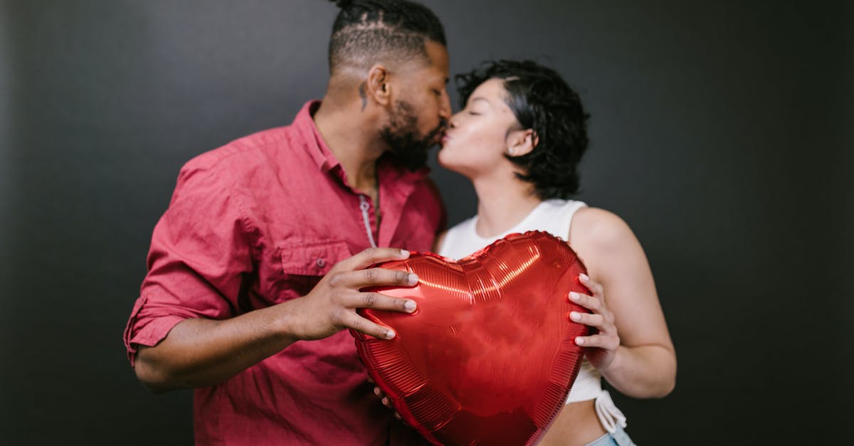 What's wrong with my oven? - Couple Kissing While Holding a Red Heart Shaped Balloon What's wrong with my oven? - Couple Kissing While Holding a Red Heart Shaped Balloon