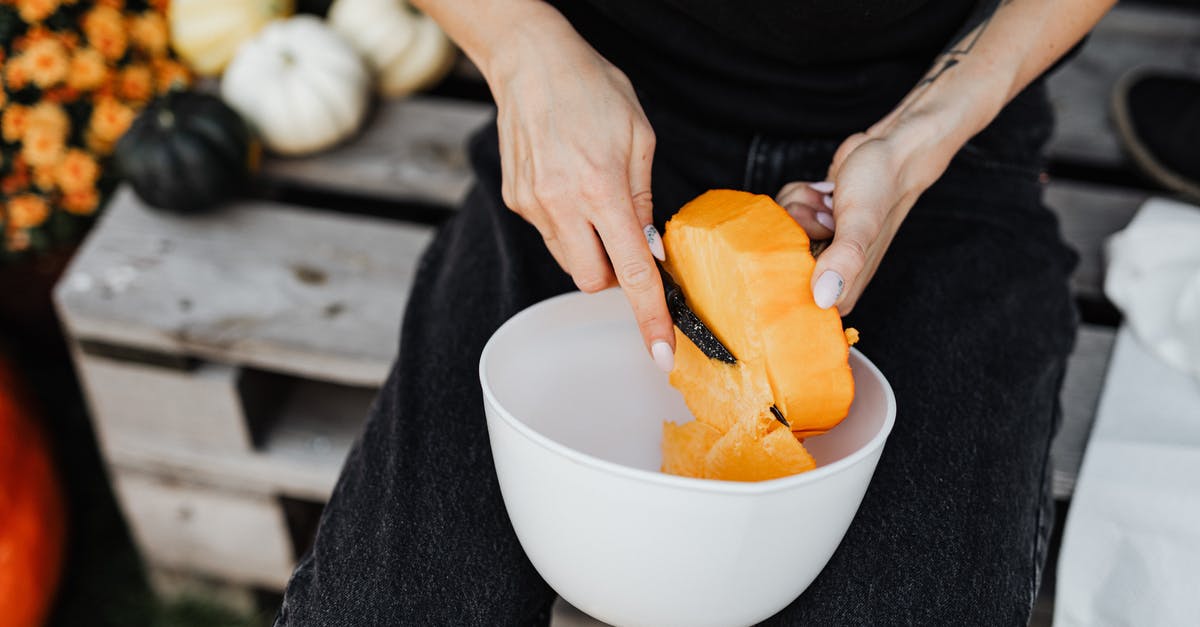 What are double-cut chops? - Person Holding Sliced Orange Fruit in White Ceramic Bowl