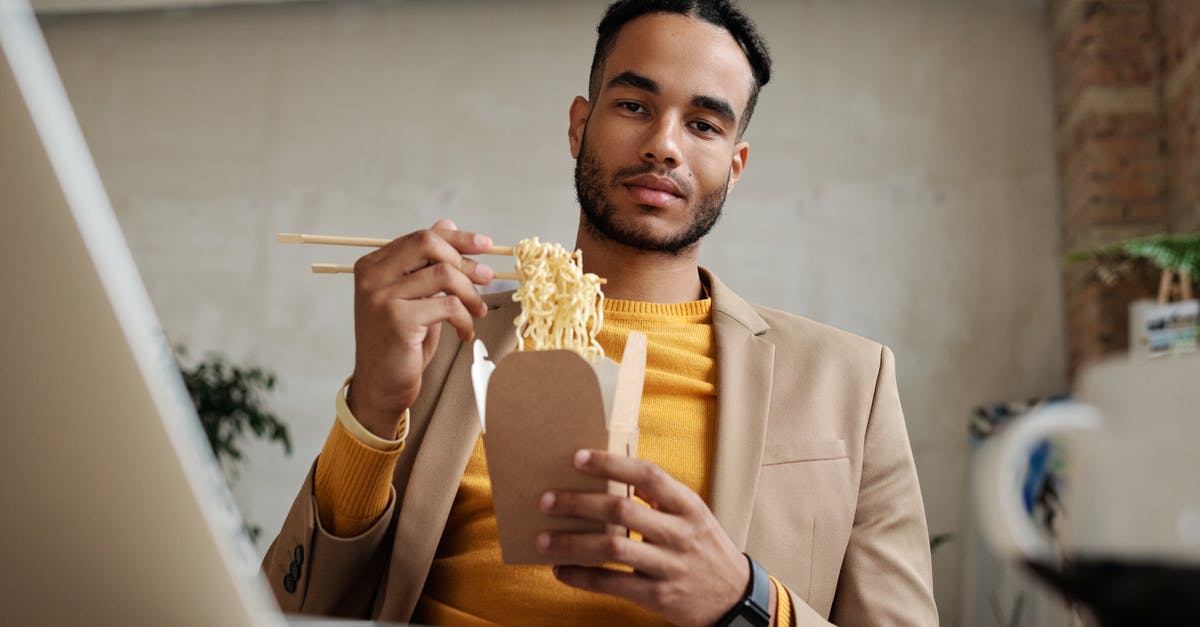 What are Maggi noodles and what's a good bulk substitute? - Man in Brown Blazer holding a Food Takeout What are Maggi noodles and what's a good bulk substitute? - Man in Brown Blazer holding a Food Takeout