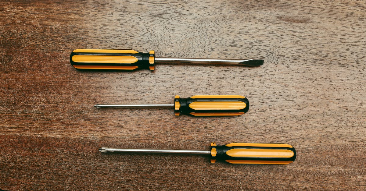 What are some grilling tools that everyone should have? - Yellow and Silver Screw Driver What are some grilling tools that everyone should have? - Yellow and Silver Screw Driver