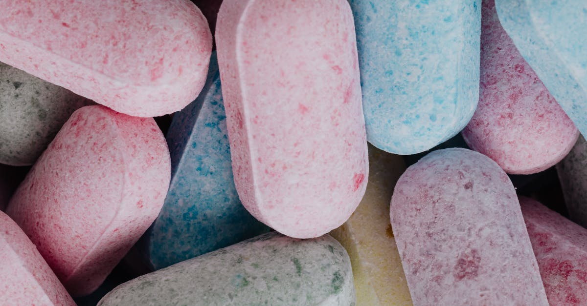 What are sugar-free sweets actually made from? - Top view of full frame background of multicolored sweet dragess composed in heap What are sugar-free sweets actually made from? - Top view of full frame background of multicolored sweet dragess composed in heap