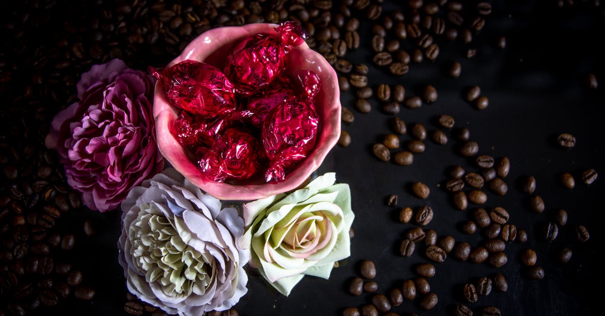 What are sugar-free sweets actually made from? - Candies And Flowers On Black Surface What are sugar-free sweets actually made from? - Candies And Flowers On Black Surface