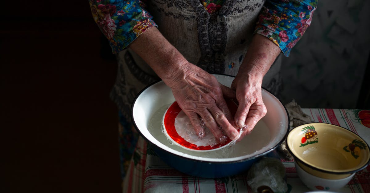 What are the consequences of not rinsing hermetic lentils prior to use? - A Person Rinsing a Saucer with Water from a Stainless Steel Basin What are the consequences of not rinsing hermetic lentils prior to use? - A Person Rinsing a Saucer with Water from a Stainless Steel Basin