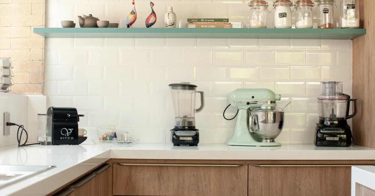 What are the main differences between a stand mixer, a countertop blender and a food processor? - Contemporary kitchen in stylish design with many modern appliances and kitchenware on cabinets What are the main differences between a stand mixer, a countertop blender and a food processor? - Contemporary kitchen in stylish design with many modern appliances and kitchenware on cabinets
