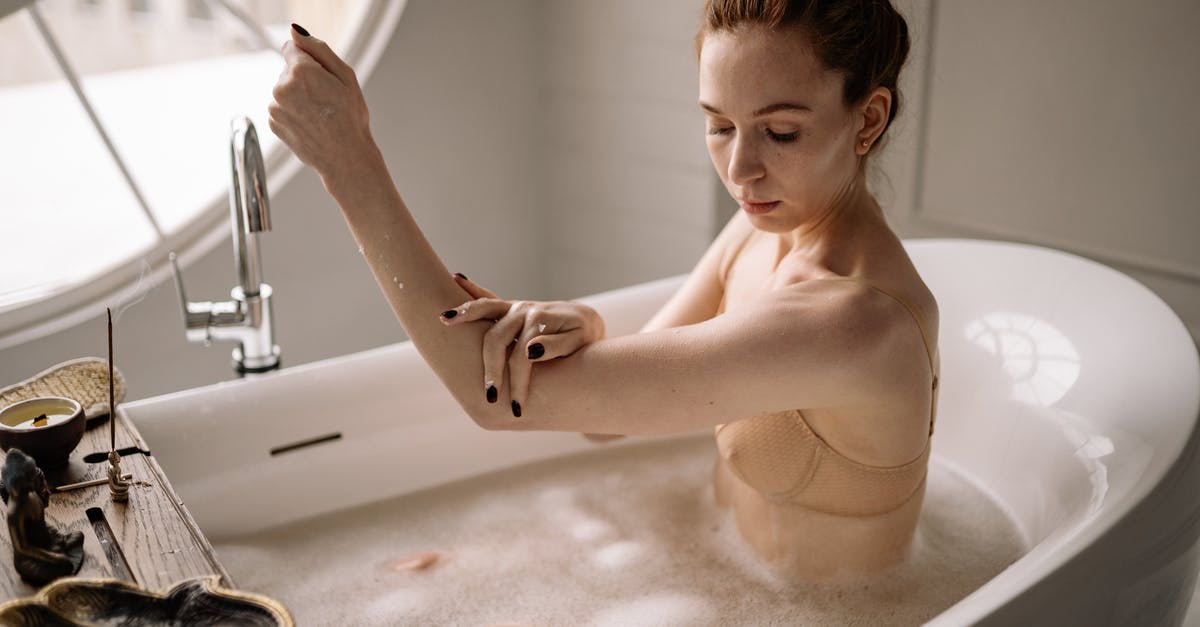 What are the slimy bubbles in soaked kombu? - A Woman Soaking in Bathtub with Soapy Water
