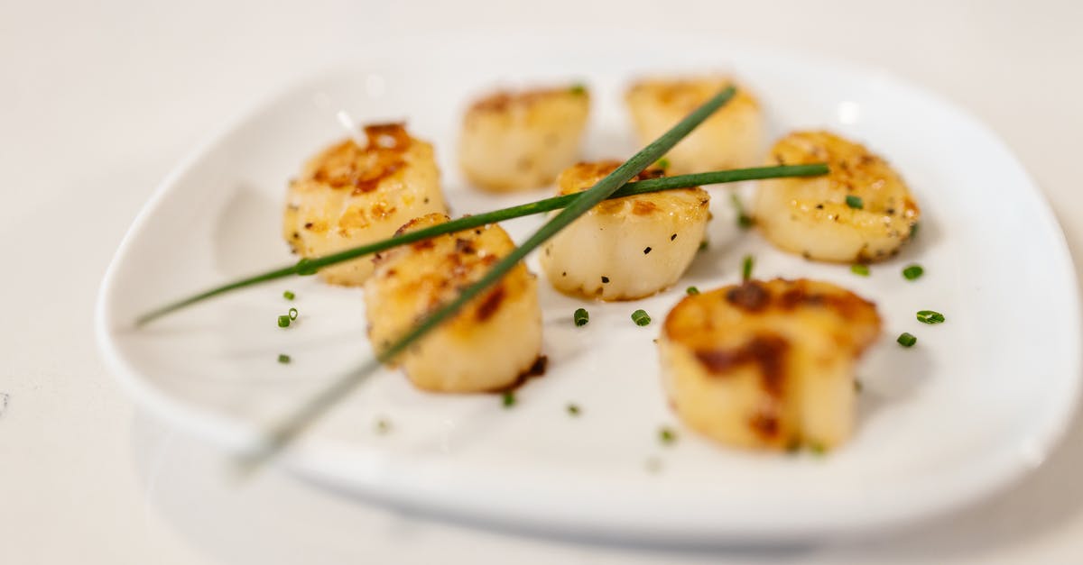 What are the tasteful herbs served with dizi in Iran? - Fried Scallops with Herbs Served on White Plate What are the tasteful herbs served with dizi in Iran? - Fried Scallops with Herbs Served on White Plate