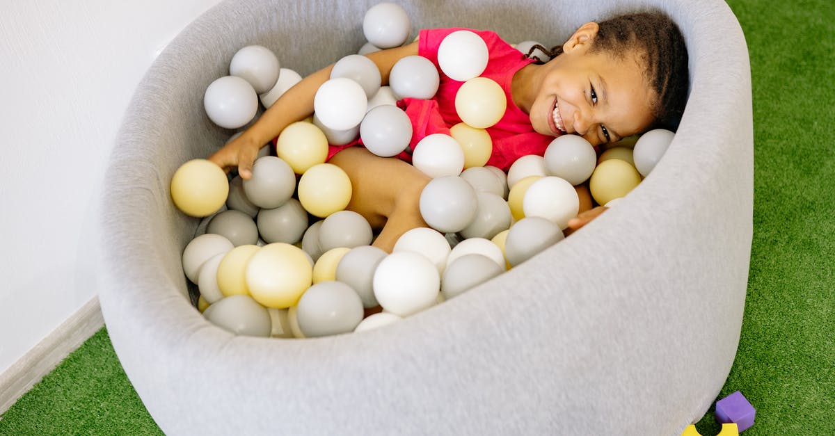 What are these little balls in my sardines? - Girl With Braided Hair Playing Balls In A Tub What are these little balls in my sardines? - Girl With Braided Hair Playing Balls In A Tub