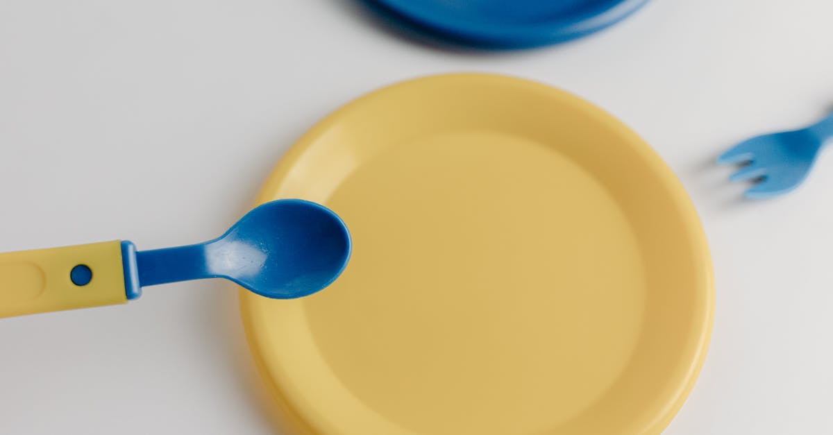 What are these utensils? - Blue Plastic Spoon on Yellow Round Plate What are these utensils? - Blue Plastic Spoon on Yellow Round Plate