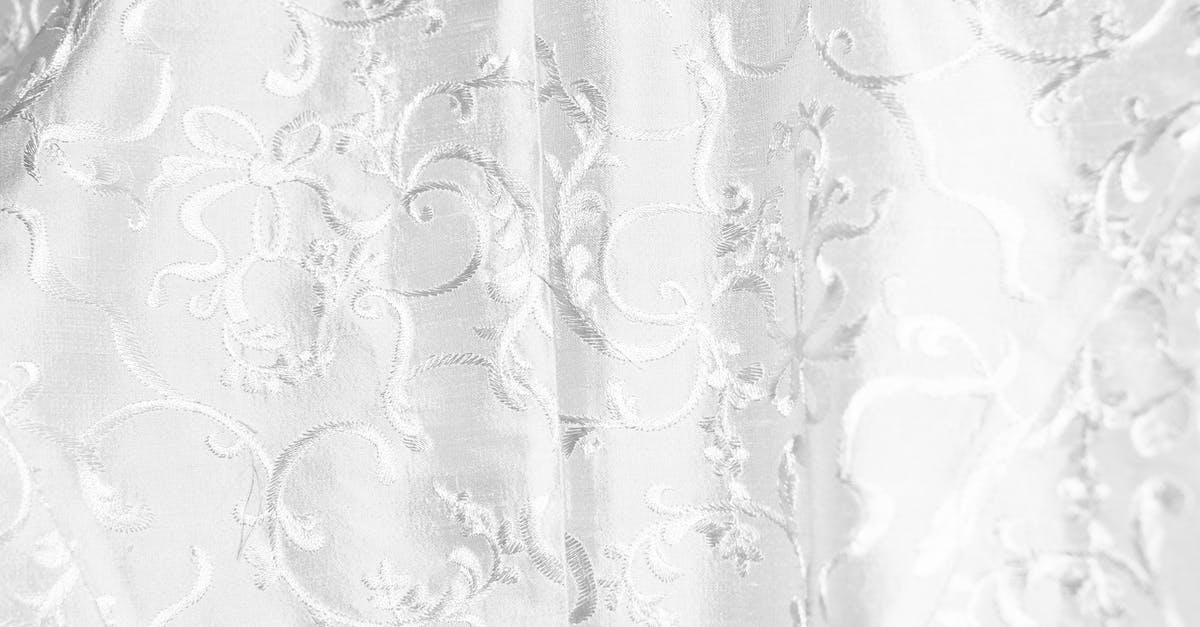 What are these white and thick things in my egg? - Background of white curtain with bright thick textile and creative design with ornamental elements creating swirls hanging in light room What are these white and thick things in my egg? - Background of white curtain with bright thick textile and creative design with ornamental elements creating swirls hanging in light room